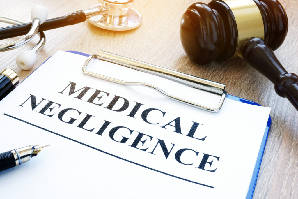 South African doctor reviewing patient records and medical indemnity documents